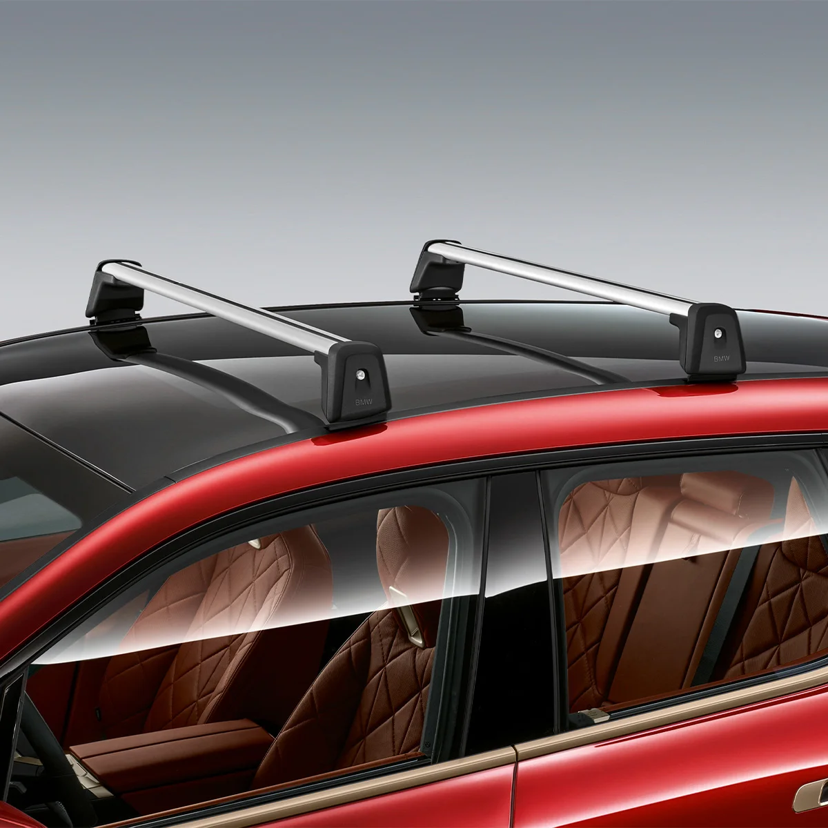 Original BMW Dachträger montiert auf rotem BMW – erhältlich bei der Wahl-Group