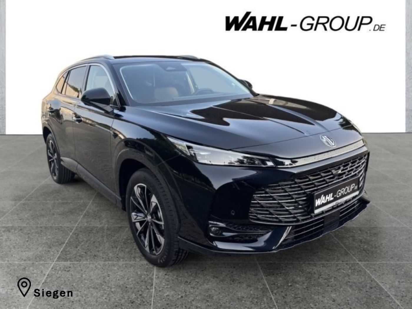 MG HS Hybrid+ Luxury Pebble Black bei der Wahl-Group Siegen. Kraftstoffverbrauch kombiniert: 5,5 l/100 km; CO₂-Emissionen: 126 g/km; CO₂-Klasse: D.