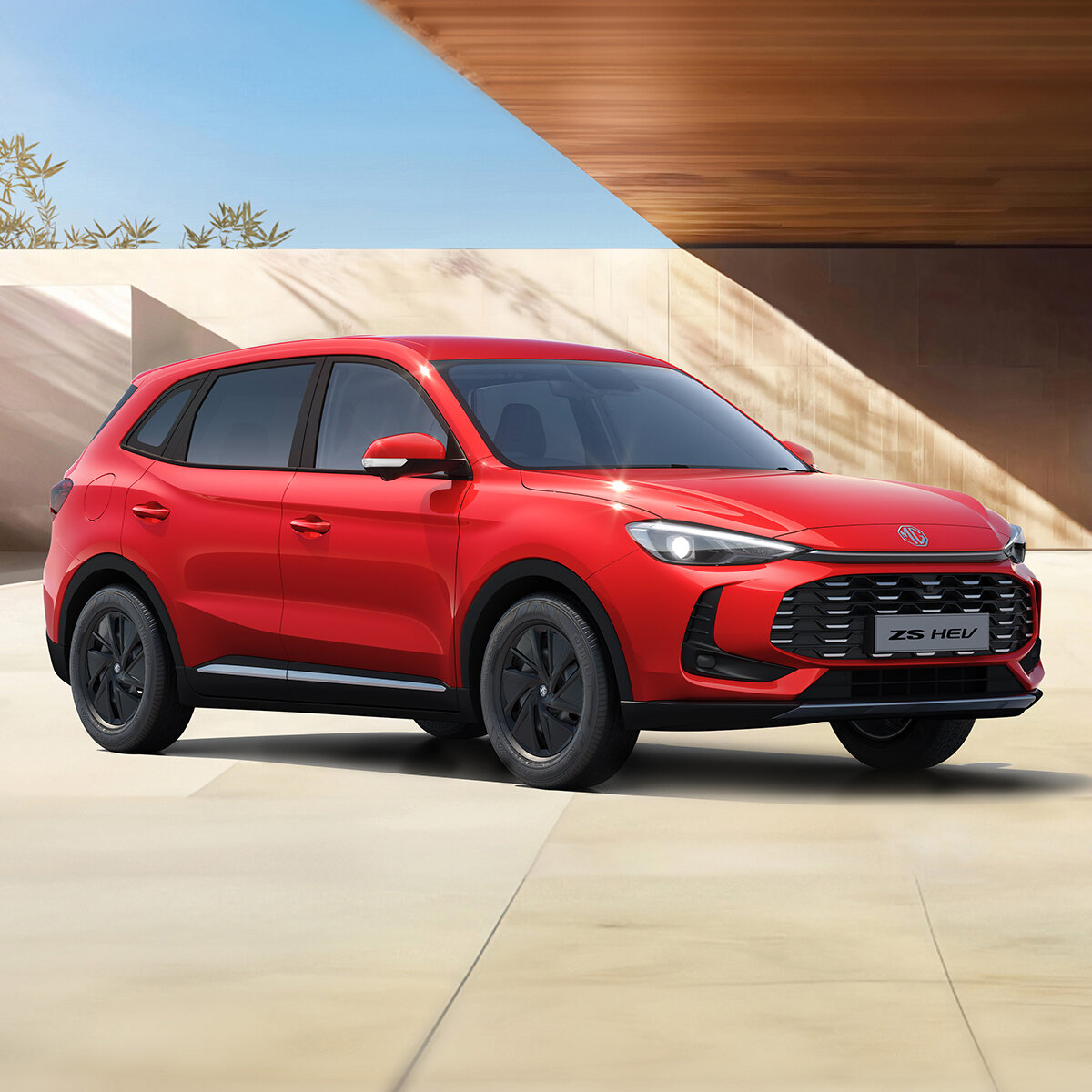 MG ZS Hybrid+ 2024 Seitenansicht - Hybrid SUV ab 22.990 Euro bei der Wahl-Group MG ZS Hybrid+ in Diamond Red - Dynamische Seitenansicht des Kompakt-SUV mit 197 PS Hybridantrieb. Effizientes SUV mit nur 5,0l/100km Verbrauch.